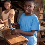 medium-shot-kid-with-hammer-hitting-nail_23-2148931068